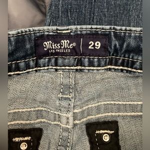 Miss Me Jeans. Mid-rise tailored boot.